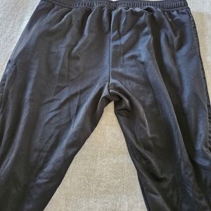Men’s Adidas black on black track pants. Size XL.